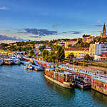 Sunset over Belgrade and ships in the harbor. HDR image